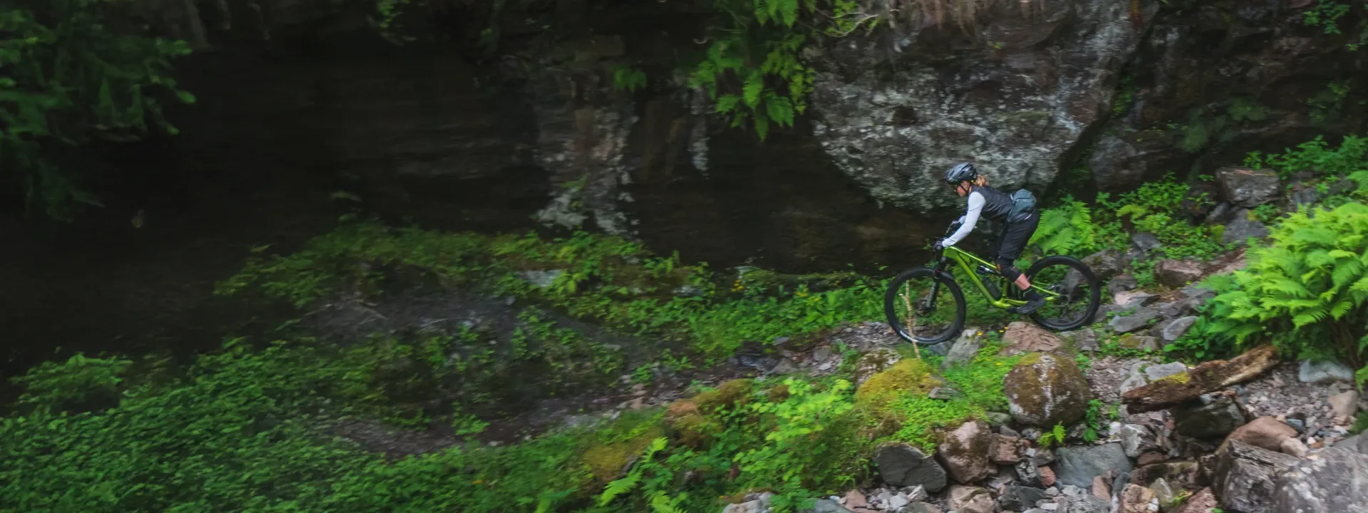 Women’s mountain bike rider on a forest trail