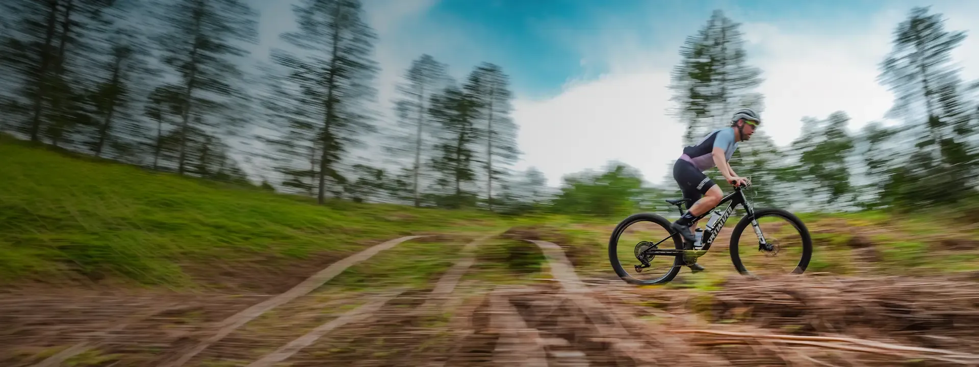 XC mountain bike racing across open terrain