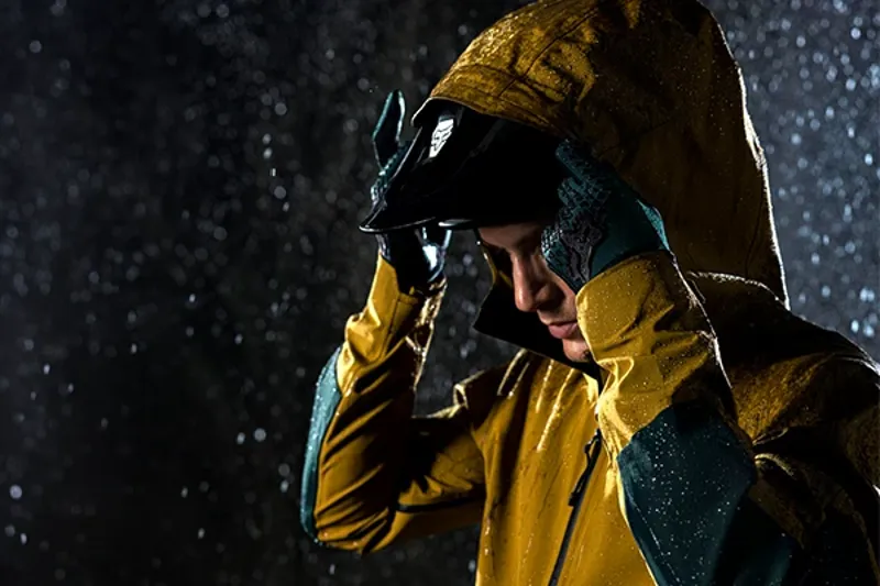 Close-up of MTB jacket showing hood and rain beading off surface