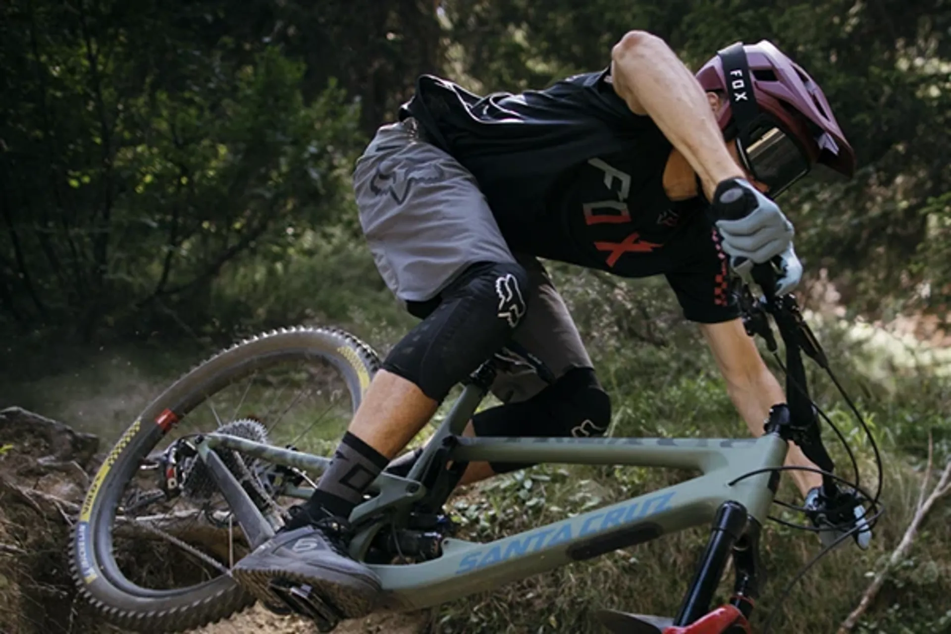 Mountain biker wearing fox MTB shorts riding technical terrain