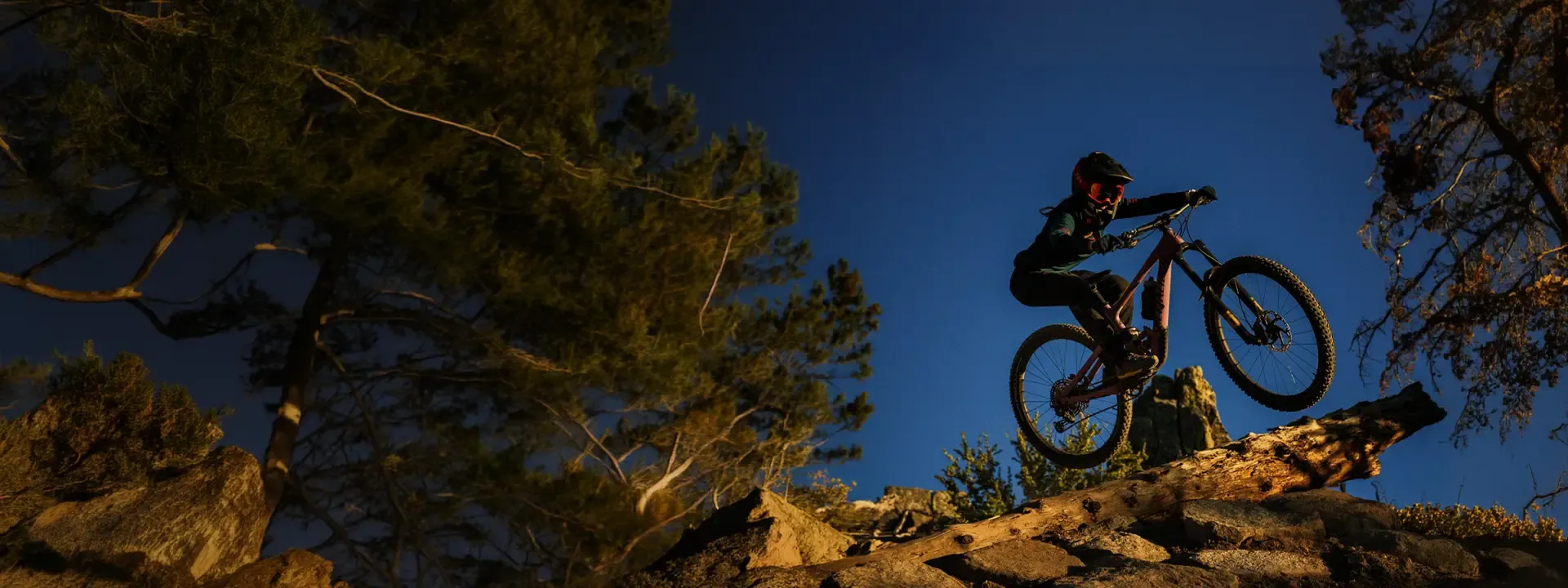 Female mountain biker wearing MTB trousers on a trail ride