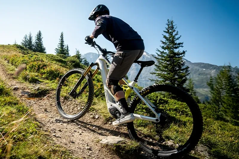 Electric mountain bike climbing a steep mountain trail