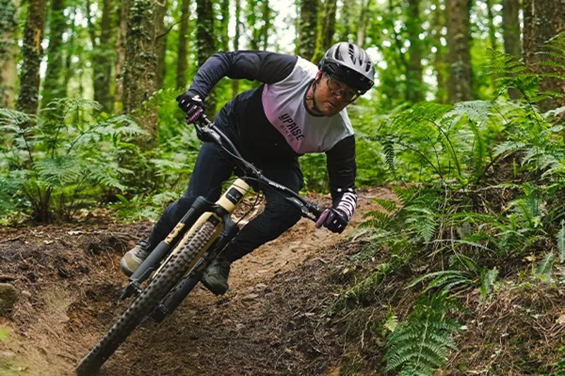 Trail rider wearing a mountain bike helmet