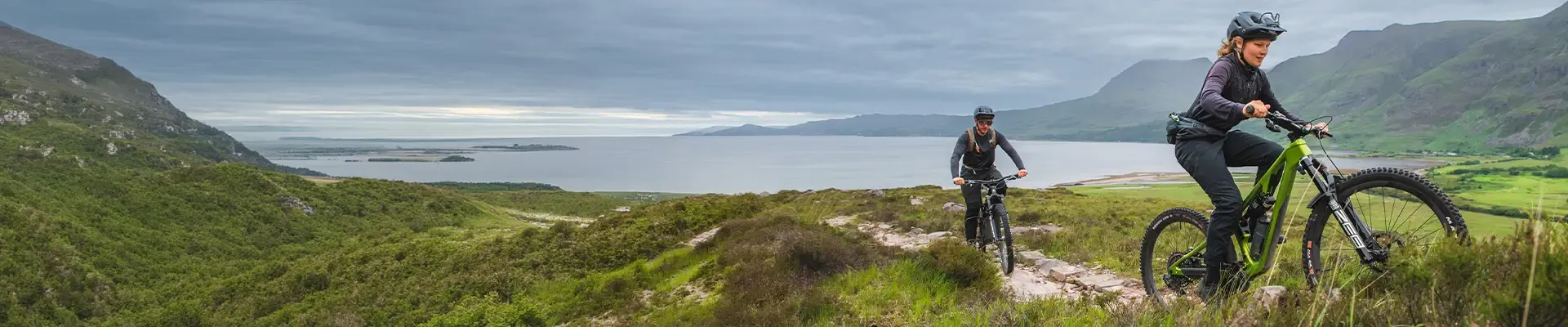 Mountain bikers riding technical trails in MTB trousers