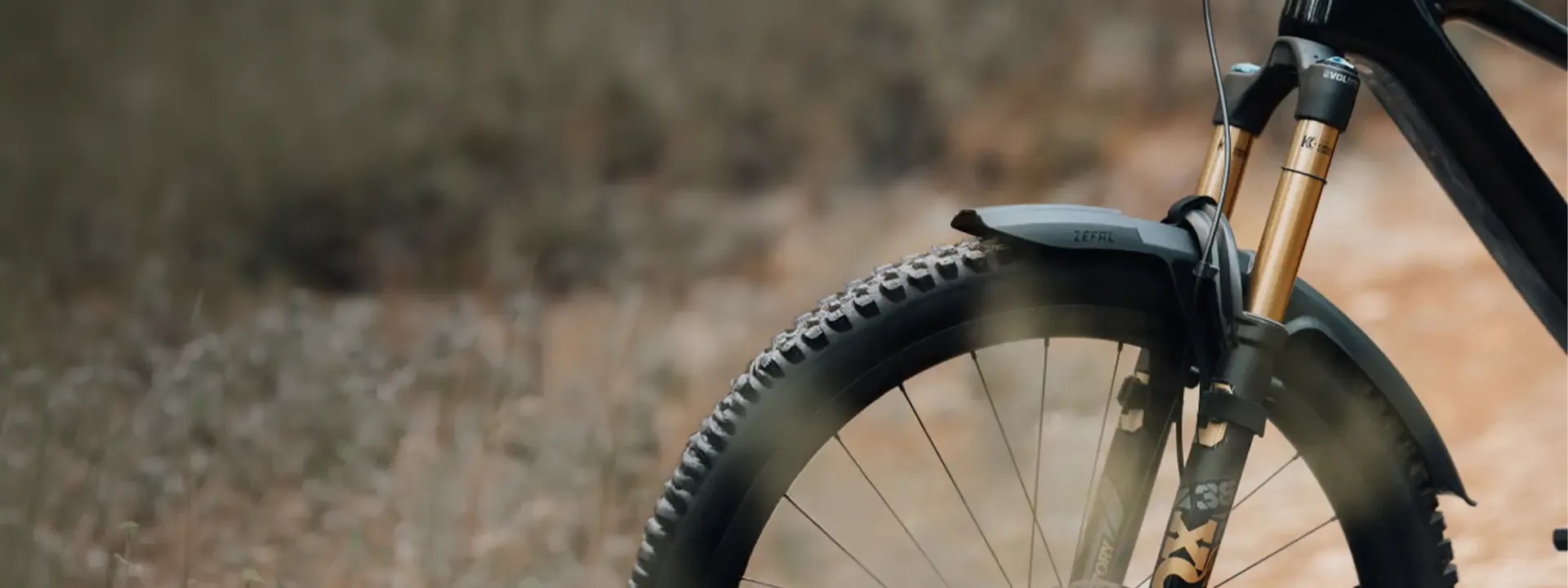 Front mudguard fitted above a mountain bike front tyre