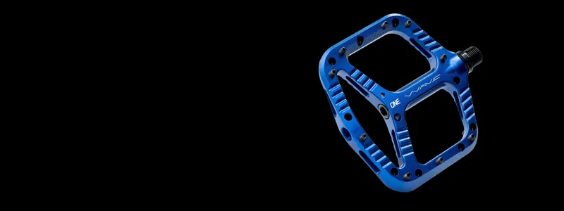 OneUp flat and clipless MTB pedals on a mountain bike