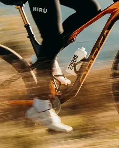 Water bottle mounted inside an Orbea Oiz frame while riding