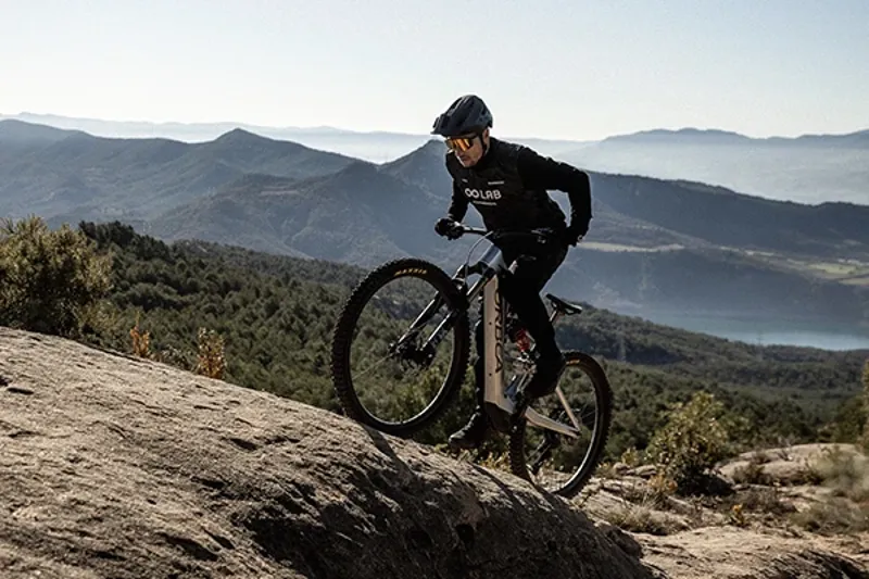 Climbing a sttep rock slab on the Orbea Rise eMTB