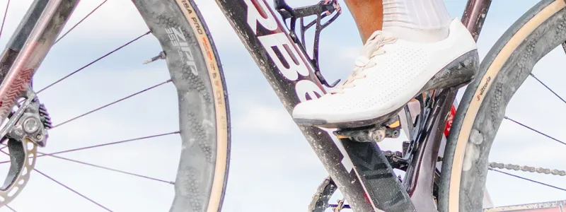 Close up of pedal on road bike racer on dusty orbea bike