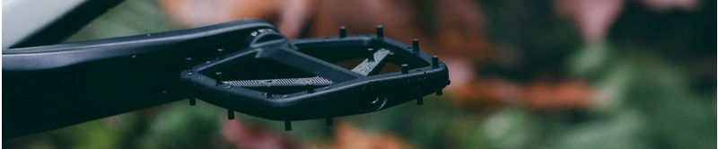 Close-up of bike pedals on the trail