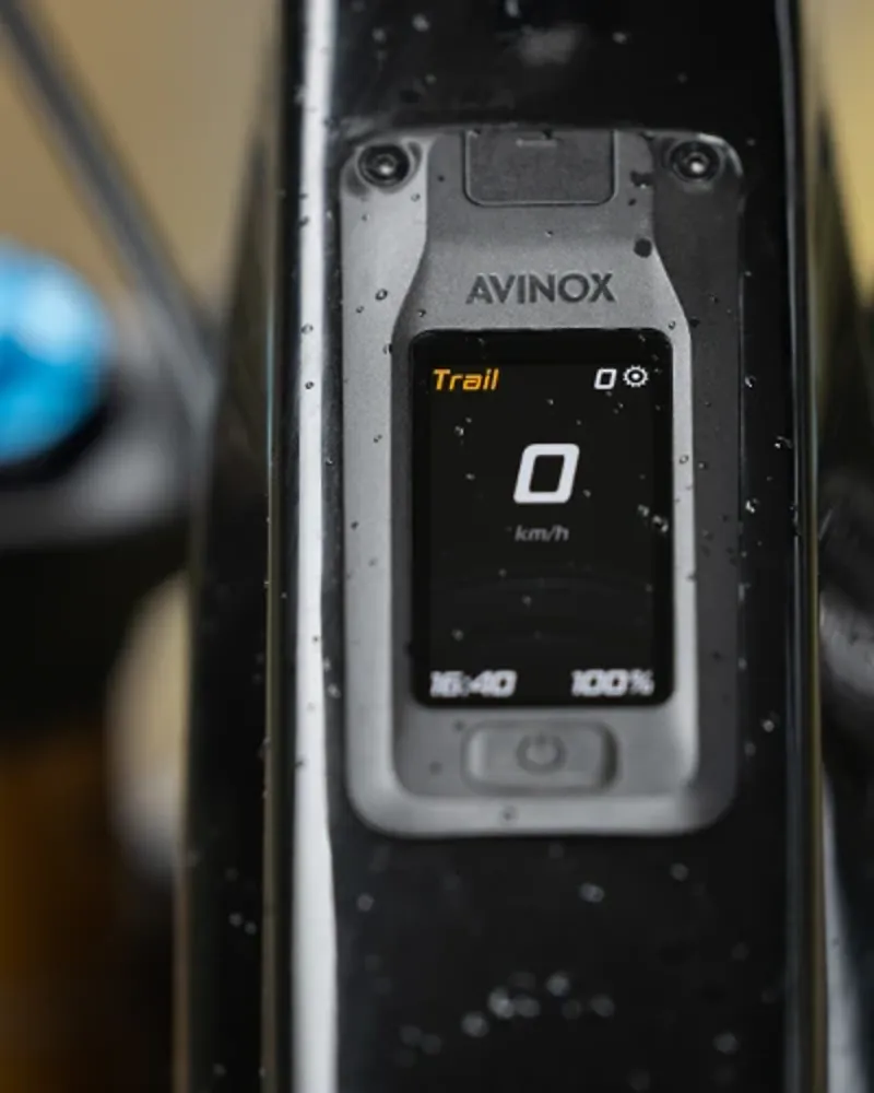 Avinox top-tube display integrated into the Pivot Shuttle AMP&rsquo;d frame showing assist mode and battery status.