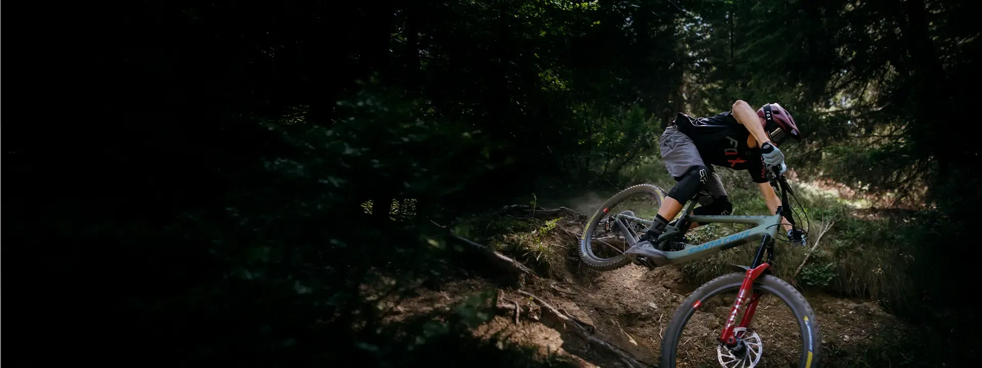Mountain biker wearing Fox body armour on a technical trail