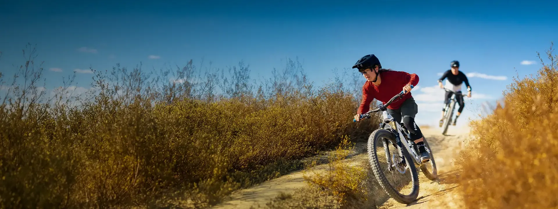 Mountain biker wearing G-Form body armour on a technical trail