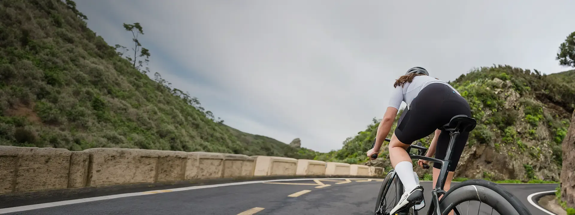 Cyclist preparing for a ride using chamois cream