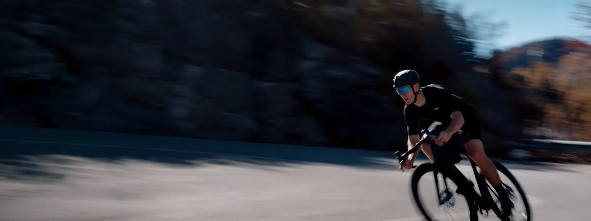 Cyclist wearing Bliz cycling glasses on a road ride