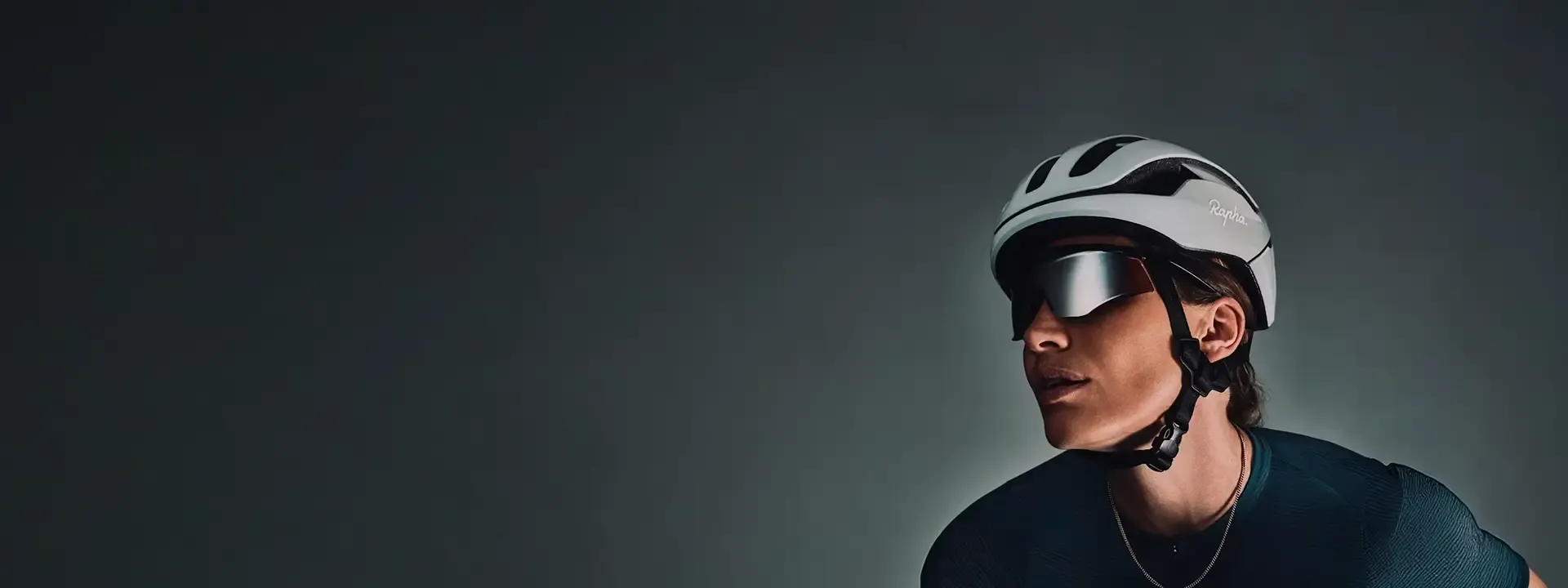 Road cyclist wearing Rapha cycling glasses