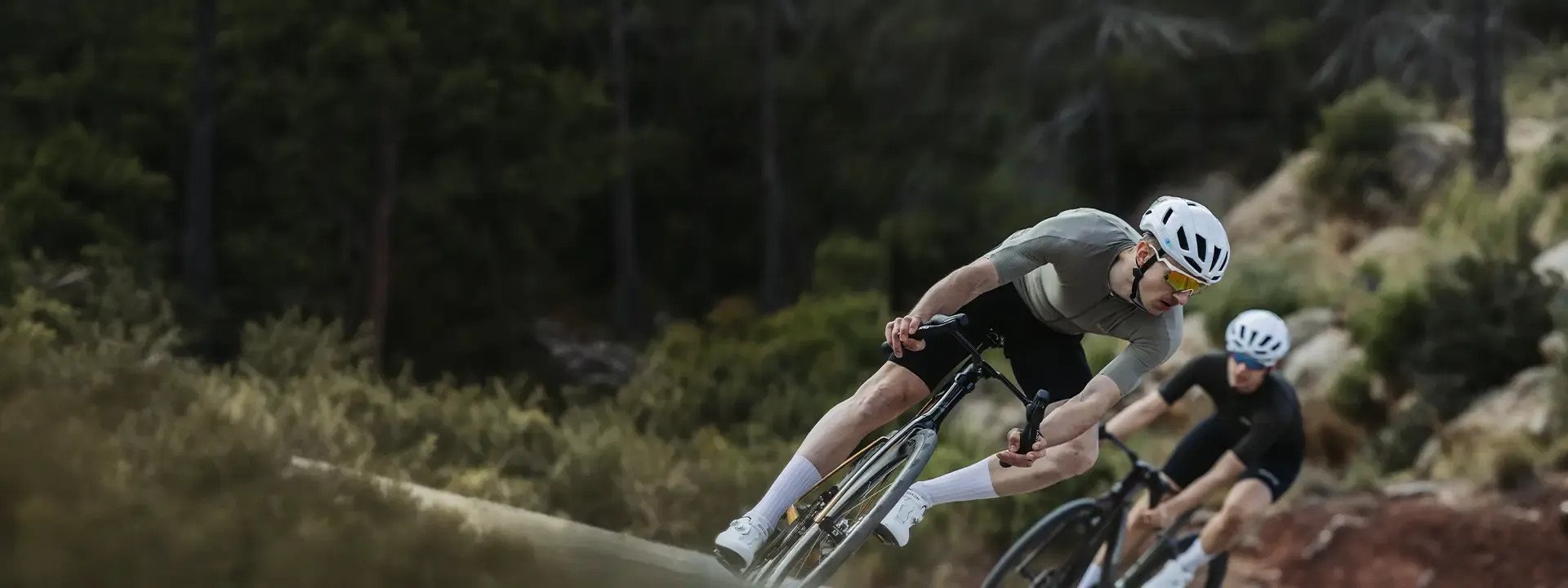 Cyclist wearing riding glasses on a road and trail ride