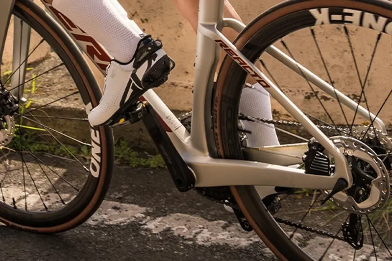 Riding a Merida Reacto road bike with clipless pedals and cycling shoes detail