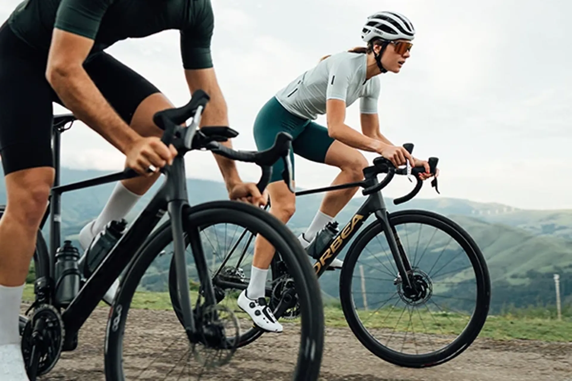 Climbing on an Orbea Orca road race bike