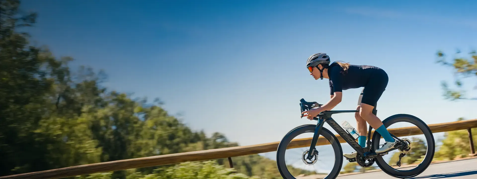 Female road cyclist wearing supportive bib shorts during a long road ride