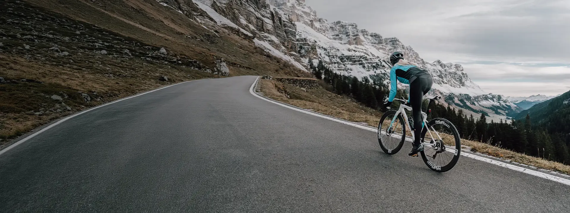 Road cyclist wearing thermal bib tights during cold weather riding
