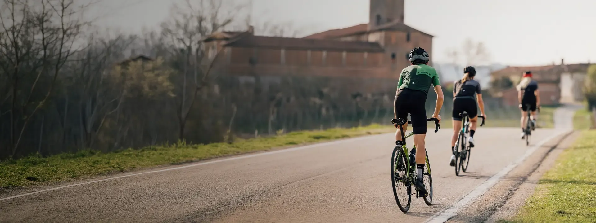 Road cyclists wearing bib shorts and tights during road rides in mixed conditions