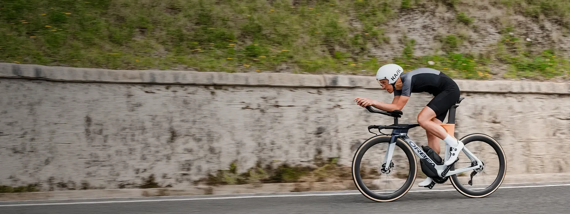 Road cyclist wearing an aerodynamic speed suit during fast road riding