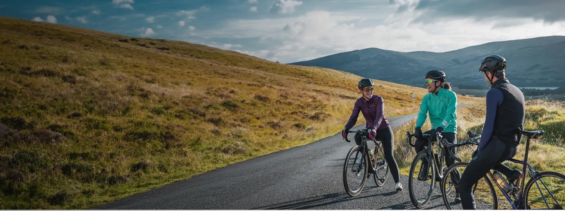 Road cyclists wearing jerseys and upper body layers on a road ride