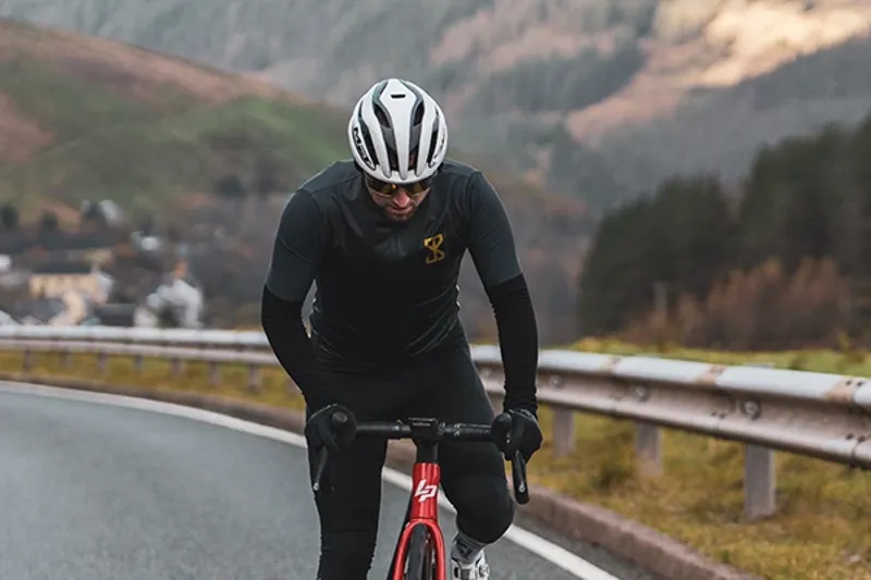 Riding a road bike with roadd bike kit includng helmet