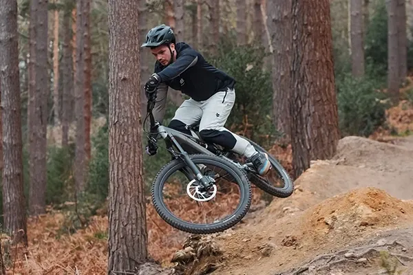 Specialized Levo Evo riding hip jump on trail