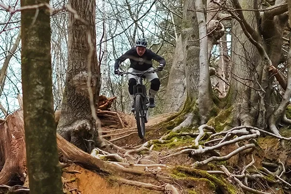 Specialized Levo Evo riding steep rooty technical descent