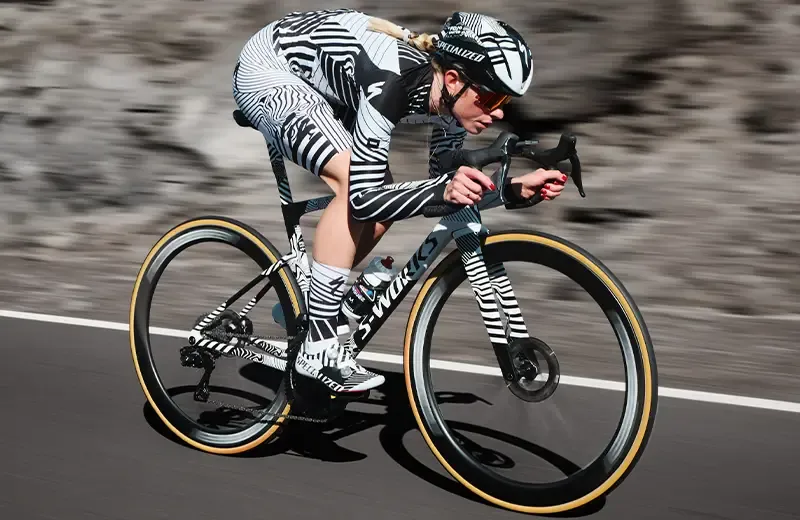 Female rider racing on a Specialized S-Works Tarmac SL9 road bike