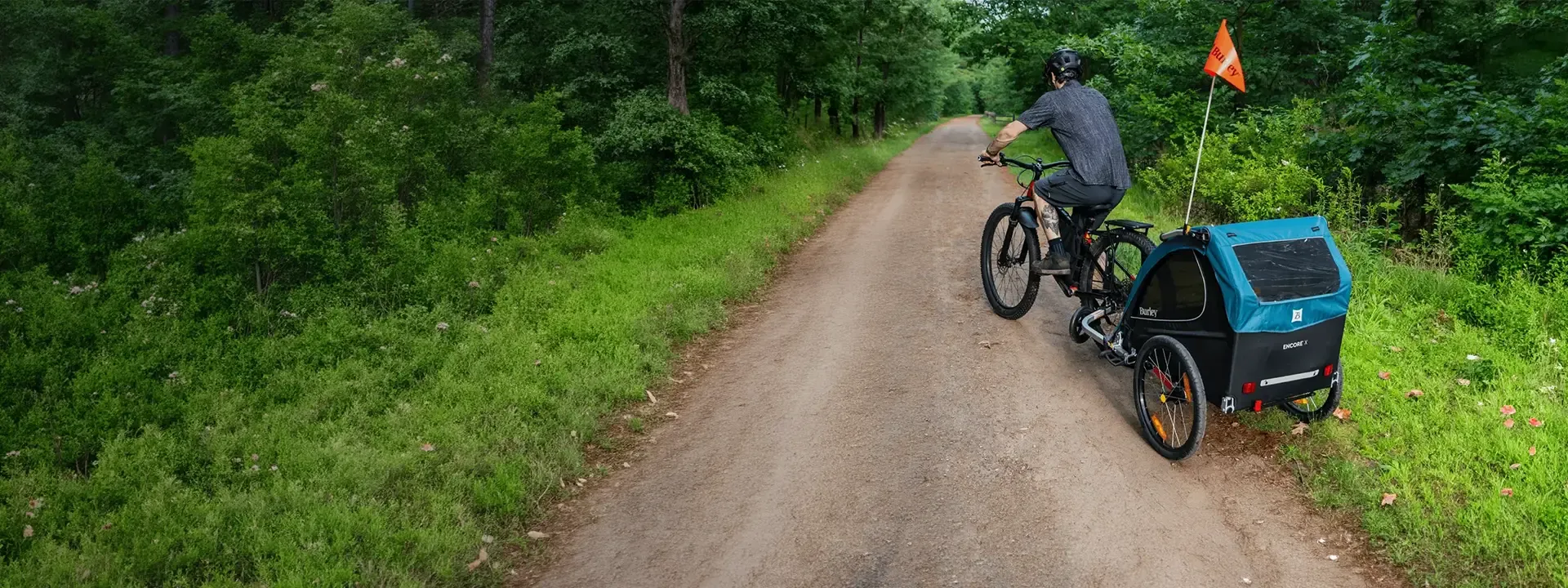 Family cycling with a Burley child bike trailer