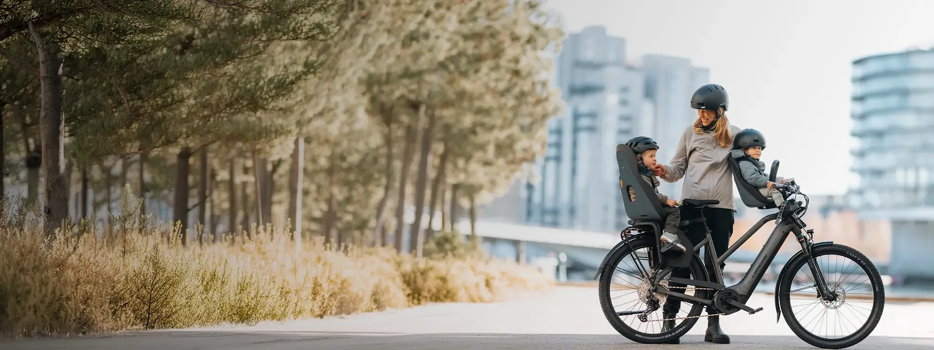 Parent cycling with a child secured in a bike child seat