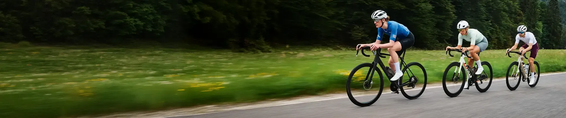 Three cyclists on Trek Domane carbon endurance road bikes on an open road