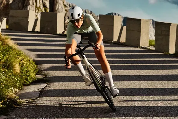 Cornering on  a mountain road on a Trek Domane SLR road bike