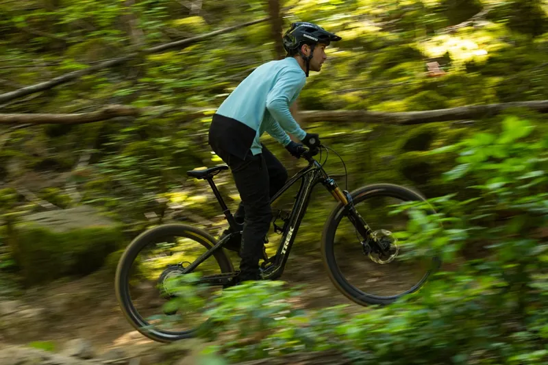 Climbing through woods on Trek Fuel+ eMTB with TQ HPR60 drive unit and 580Wh battery