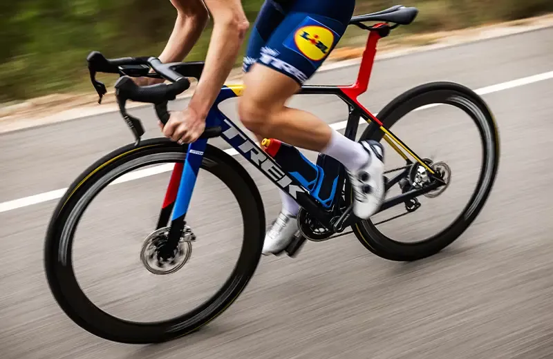 Trek Madone riding quickly on an open road, bike detail