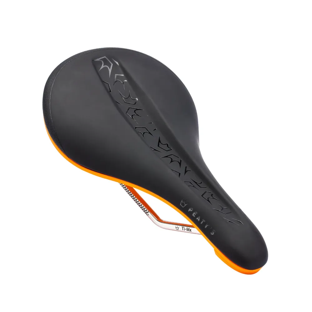 uPRISE Bikes Peaty's Monarch Ti-MX Rail/Nylon Base MTB Saddle - Mango Orange | Price match, 365 day returns, 18-Month Warranty, Finance Available & Free UK Delivery